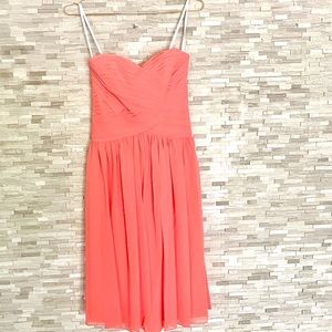 Coral knee-length bridesmaid dress